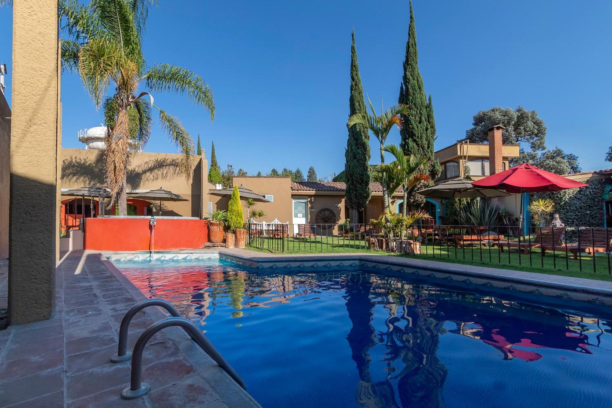 Capital O La Huerta Golf & Hotel Чолула Экстерьер фото